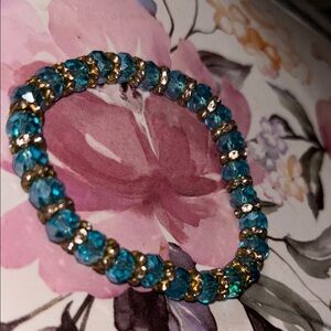 Blue Gemstone Bracelet with Clear Accents and Dark Metal Setting